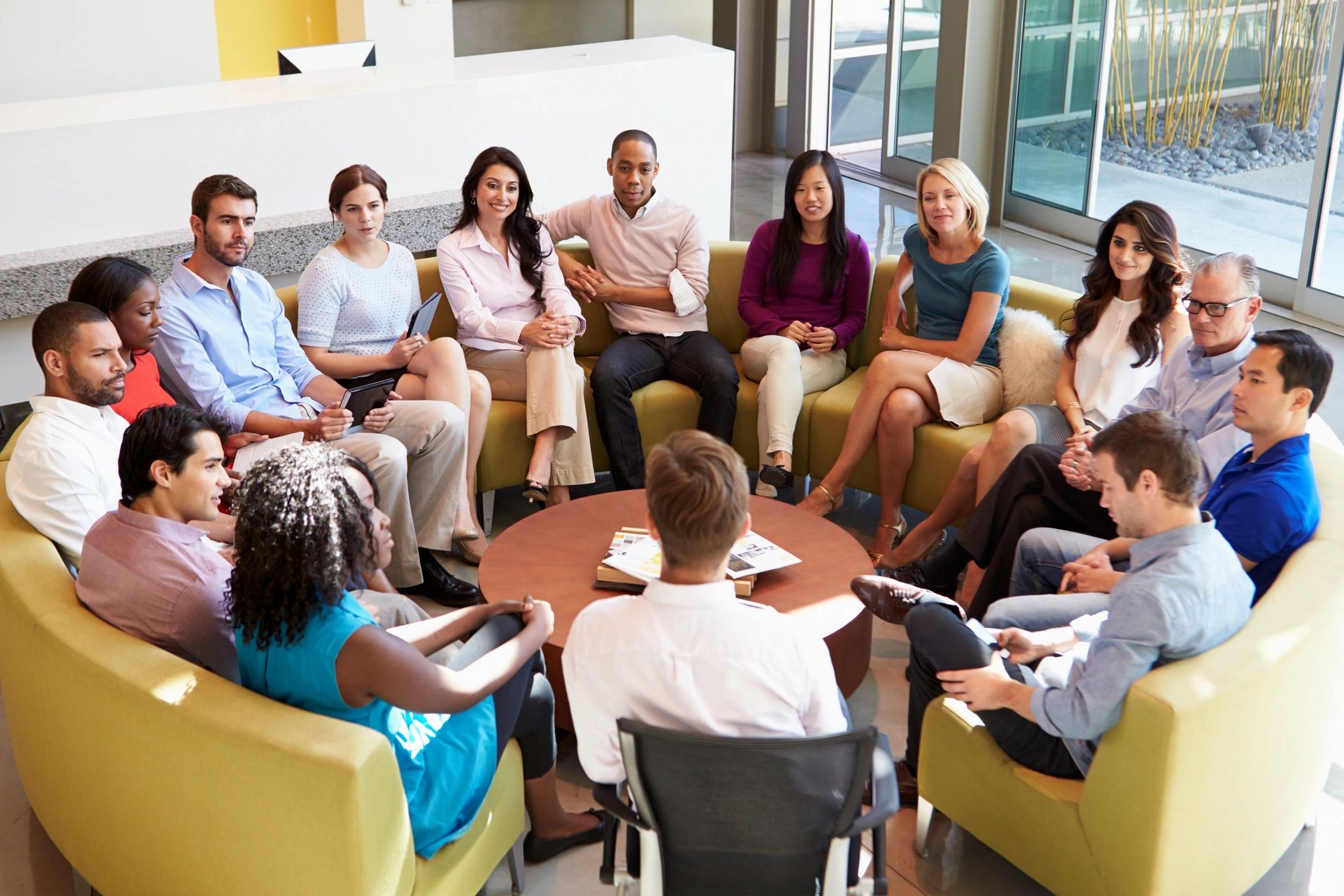 fm=f_2943 A group of people sitting around each other in a room.